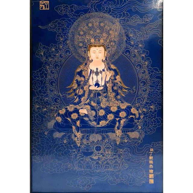 Chinese framed porcelain Buddhist temple plaque, a finely drawn and detailed depiction of Kuan Yin, in blue and gold, with...