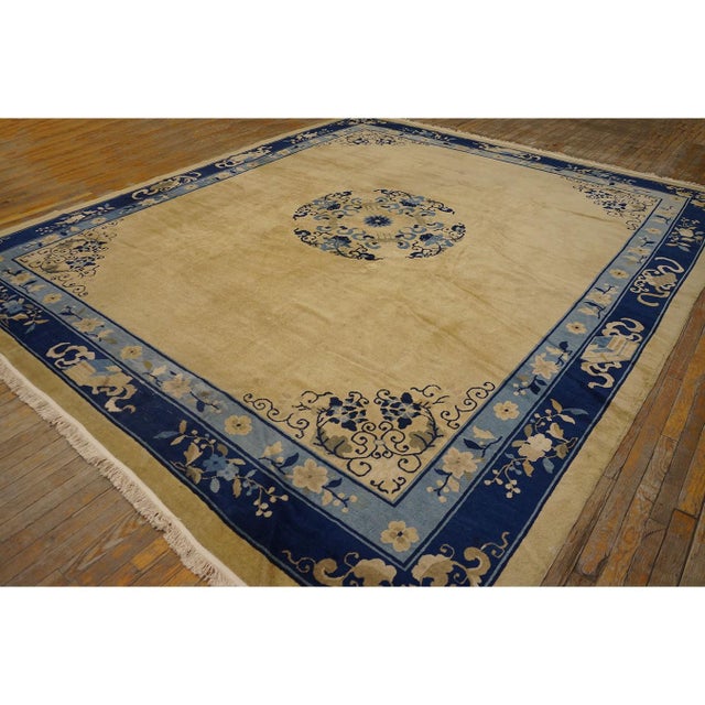 Antique Room Size Wool Ivory Rug, Circa Date: 1920s. This exceptional piece represents the height of early 20th-century...