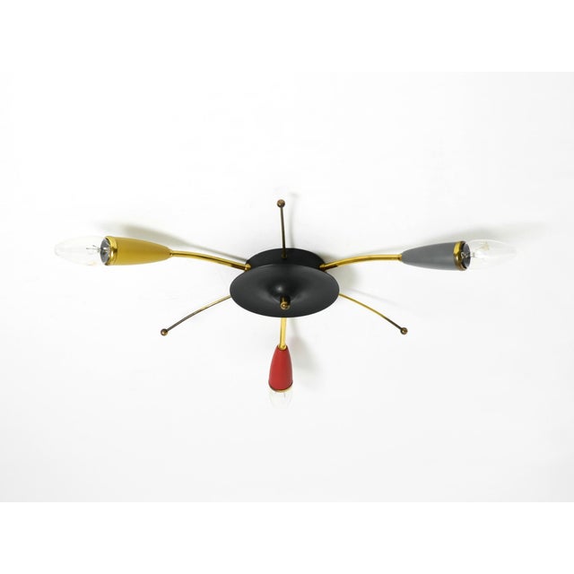 Beautiful three-armed Mid-Century Modern Sputnik ceiling or wall lamp made of brass with colorful bags over the bulb...