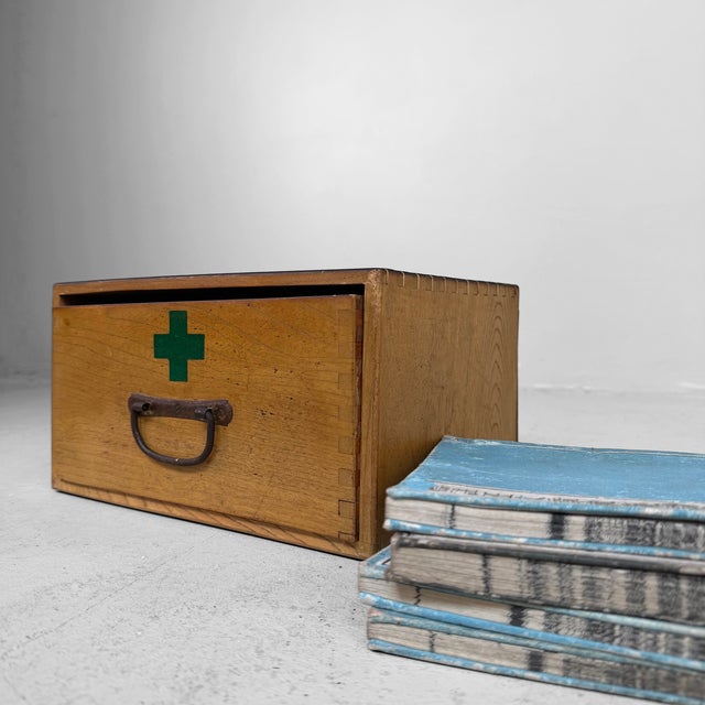 Small vintage Japanese apothecary box, or kusuri-bako, dating from the 1970s. The box is made of warm-toned wood and...