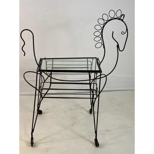 Whimsical Mid Century Black Horse Outline Bar Cart in the style of Frederic Weinberg in The 1950's.Glass topped Center...