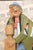 A painted wood carving of a character by listed 20th century artist Duff Tweed. This piece presents a wood carving of a...