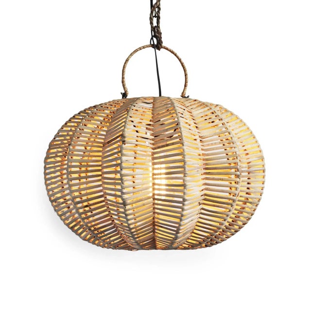 Handmade split raw rattan pumpkin lantern. Overall measurements are 16" x 16" x 12" with 3" top ring. Each lantern may...