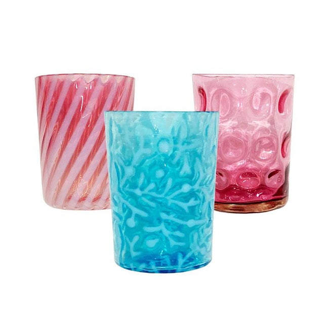 A set of three Hobbs drinking glasses in Seaweed Blue, Ruby, and Flashed Cranberry. This vintage hard-to-find set of three...