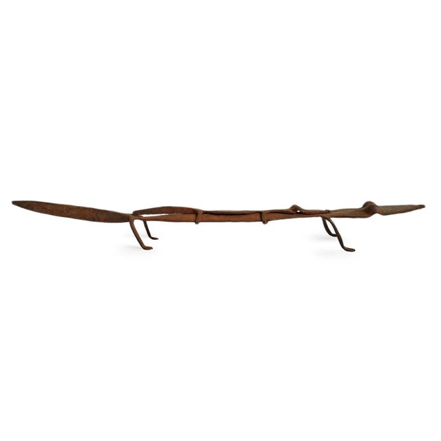 Vintage forged iron lizard sculpture from the Dogon people of Mali. This piece is a striking example of traditional...
