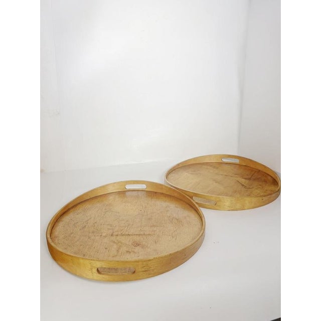 Set of two Swedish serving trays dating from the 1990s, crafted from light-toned wood with a simple and functional...