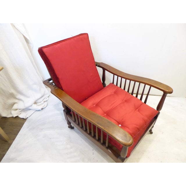 19th Century Morris chair on casters, reclines, sturdy, new strapping, could benefit from having new cushions.