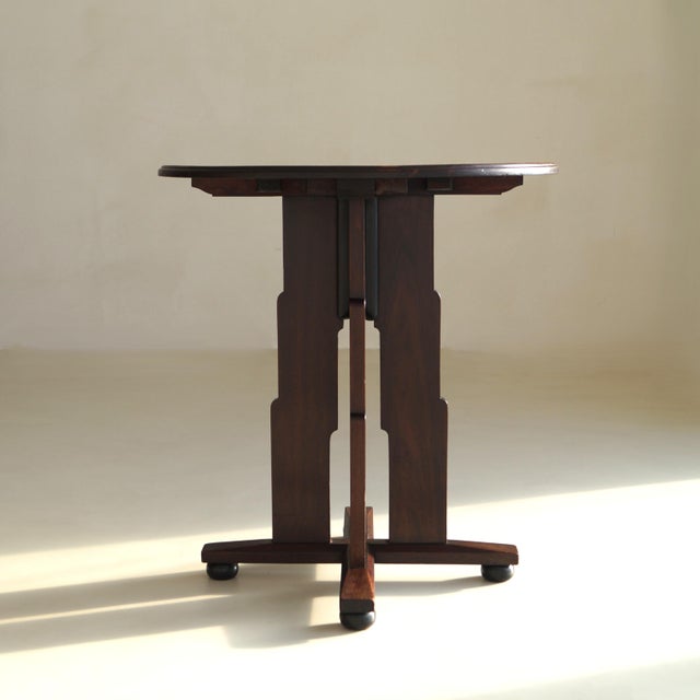 Exceptional and rare sculptural Amsterdam School side table, executed in solid mahogany and dating from the early 1920s....