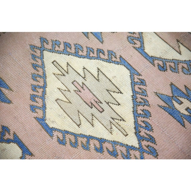 Introducing a one-of-a-kind vintage Turkish hand-knotted wool rug, carefully crafted by skilled artisans using traditional...