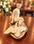 Beautiful antique Weller Muskota “Leda and the Swan” figural flower frog, featuring a graceful seated nude woman...