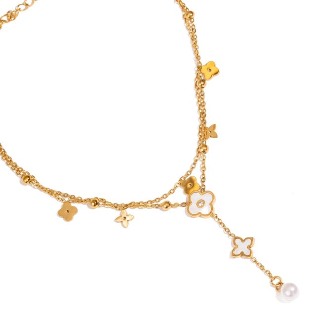 Elevate your summer style with the Floral Pearl Charm Gold Anklet, a delicate blend of feminine elegance and timeless...