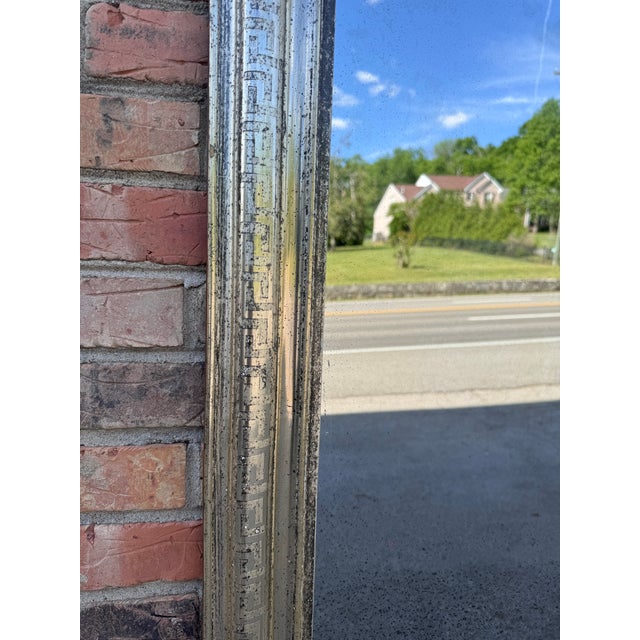 This is a gorgeous 19th Century Louis Philippe champagne colored mirror. The mirror has a beautiful neutral gold and...