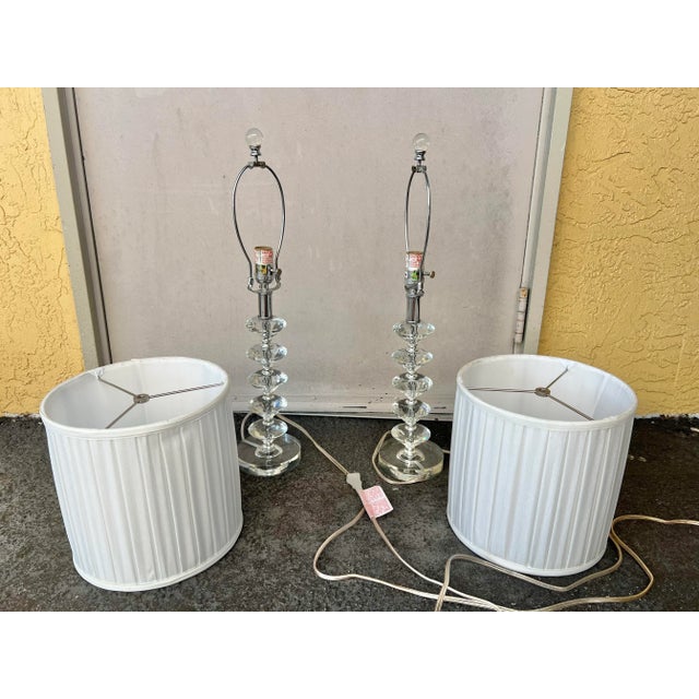 Pair of Vintage Crystal glass stacked table lamps. Illuminate your space with this set of lamps. These elegant lamps...