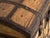 This antique iron-bound chest in pine wood is a Central European dome-topped chest with riveted wrought-iron strapwork and...