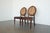 Elevate your space with this exquisite pair of vintage Drexel Heritage dining chairs, showcasing timeless elegance and...