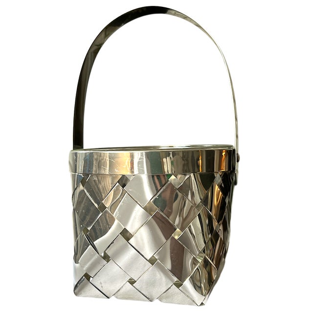 An elegant nod to classic luxury, this vintage silver-plated ice bucket brings refined texture and sleek utility to any...
