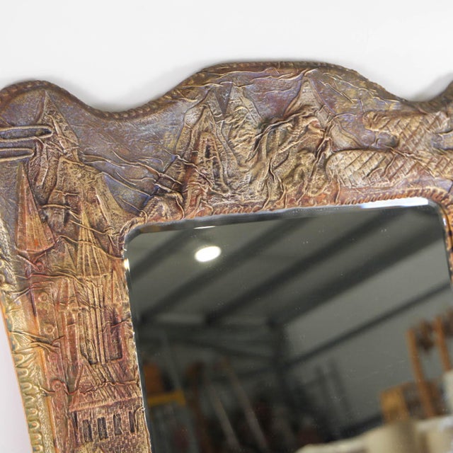 Rare large embossed leather mirror depicting various landscapes and colors. A highly decorative piece from the 1970s. A...