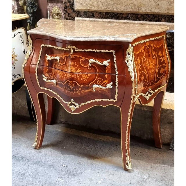 Elevate your interior with this stunning French Louis XV style commode, a sophisticated piece designed to bring timeless...