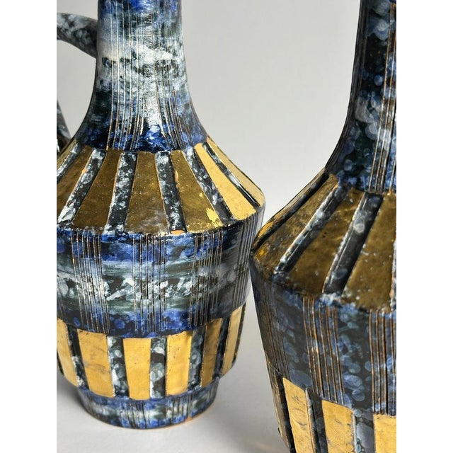 A striking pair of Italian ceramic vases by Fratelli Fanciullacci, produced in Italy during the 1960s. Designed as angular...