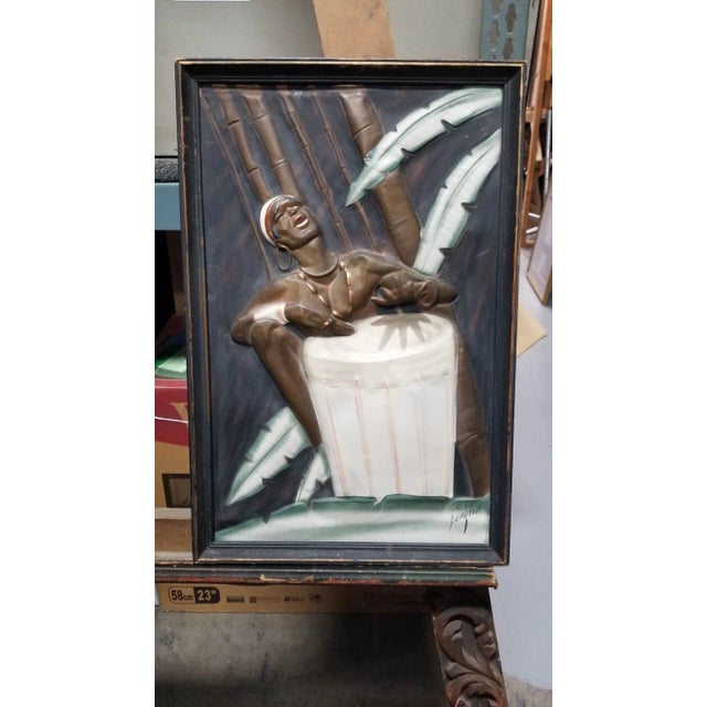 Vintage Cooper Embossed artwork Bongo Player signed C.I.E. Pearson in black Wood Framed. This vintage copper embossed...