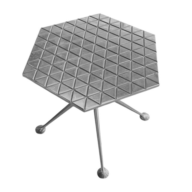 A hexagonal aluminum occasional table designed by Alexander Girard for Branif Airlines circa 1967. Made from die-cast...