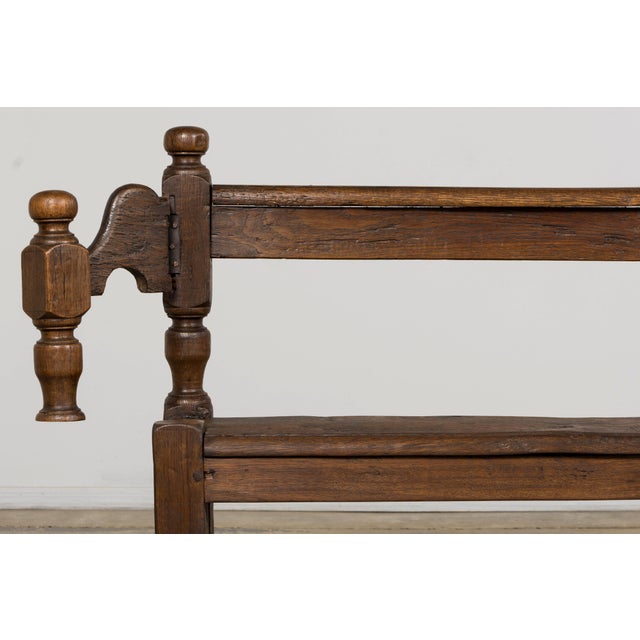 A substantial mid 19th century French Provincial oak hall bench, sourced in Provence, France. Crafted from solid oak, the...