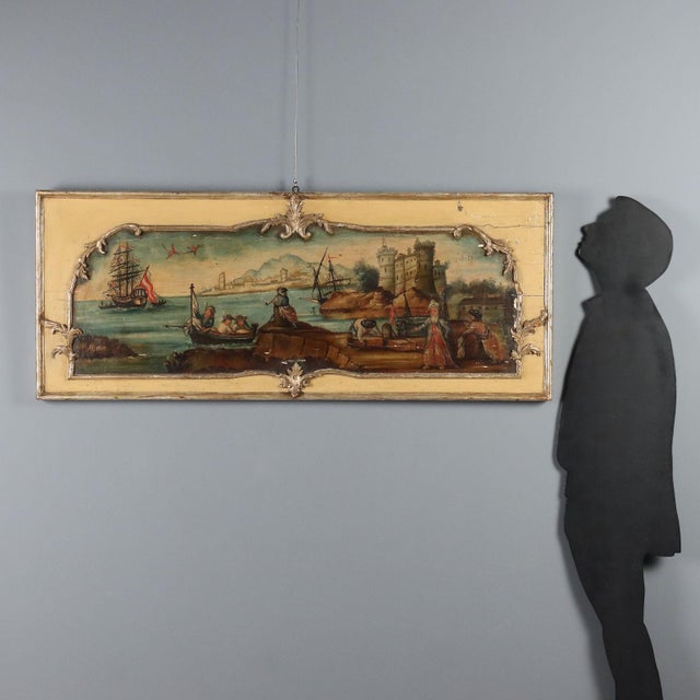 Oil on panel. Central European School, 19th century. The painting, conceived as an overdoor, features a port scene set...