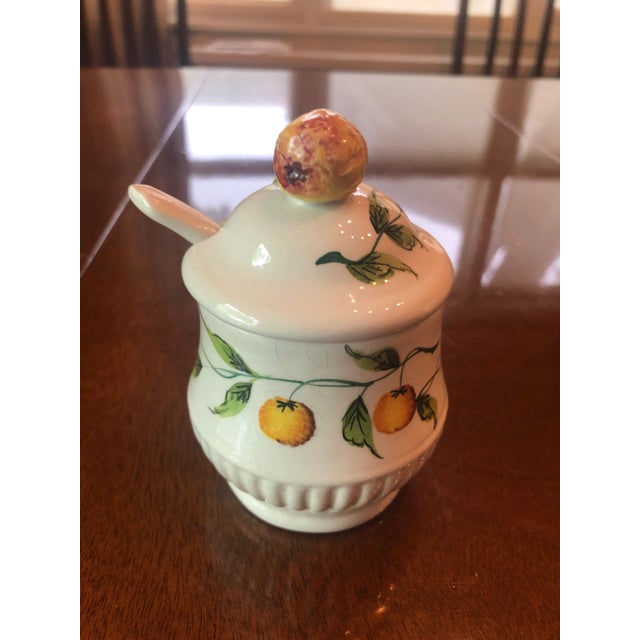 Vintage Italian hand pained jam/marmalade jar embellished with orange on top. Curvy porcelain spoon. Beautiful addition to...
