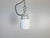 Vintage industrial light made in former Czechoslovakia during the 1970s. It features a white porcelain top and a glass...