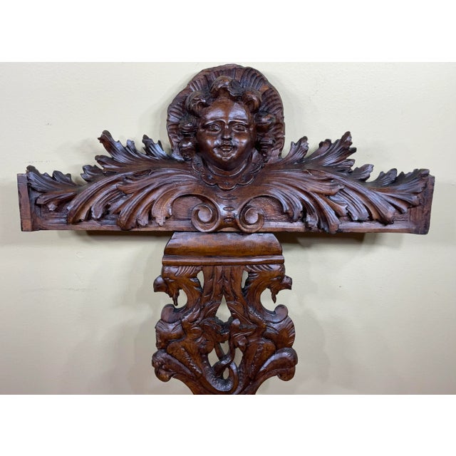 Exceptional hand carved Walnut wood sculpture of beautiful cherub face looking forward and very intricate and intriguing...