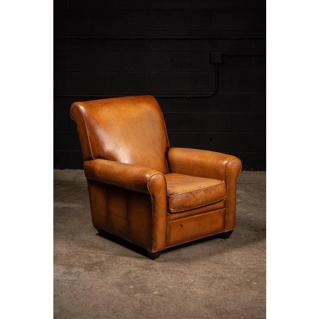 Thickly upholstered Barcalounger armchair and matching ottoman. 35" W x 36" D x 38" H Ottoman: 22" W x 18" D x 16" H Seat:...