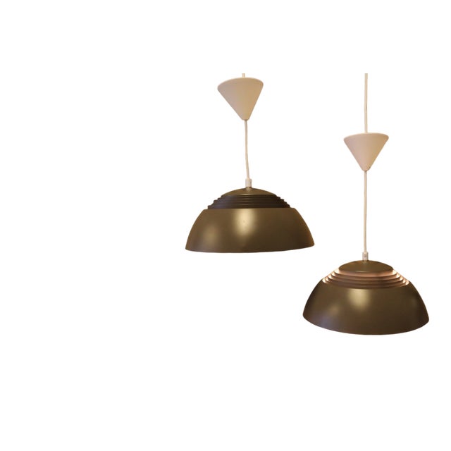 A true classic, the aj royal ceiling lamp was designed in 1960 by arne jacobsen for louis poulsen in denmark. the lamp was...