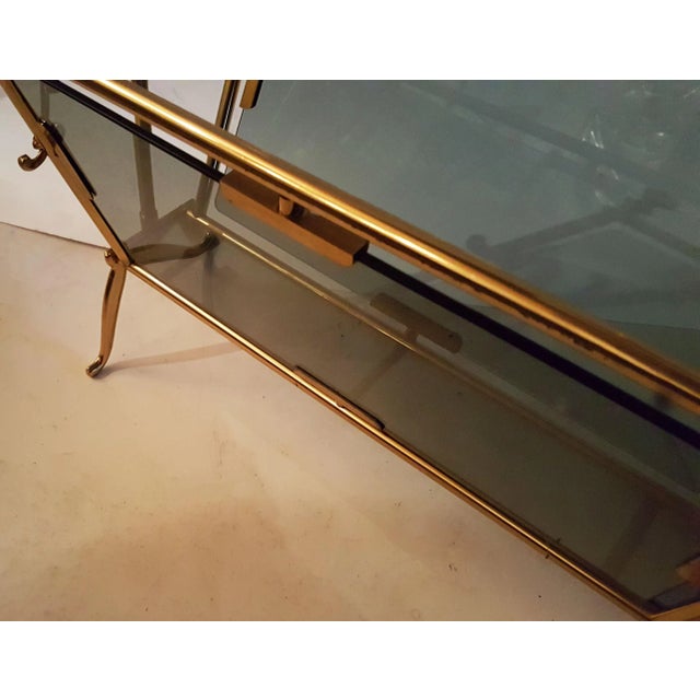 Very elegant magazine rack by Maison Bagues, Paris. Solid brass and smoked glass.