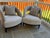Adriana Hoyos Bolero 300 armchairs. Set of two. Features upholstered seat and backrest. Includes matching throw pillows....