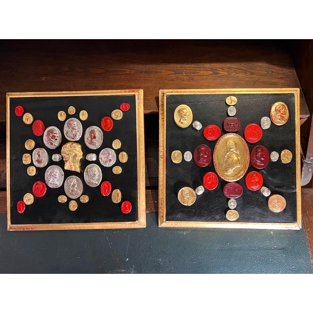 An exquisite pair of 14 in 14in , gilt frame, black leather stretched panels, displaying whimsical cameo and intaglio...