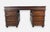 A striking campaign-style kneehole desk designed to evoke stacked vintage luggage. The distressed brown finish is accented...