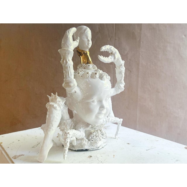 "Lobster Boy #5" by Robert Hechler from his 2026 exhibition "Babes in Lobster Land," featuring a series of porcelain...