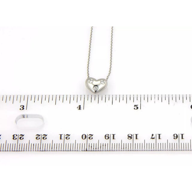 This authentic Tiffany & Co. piece is finely crafted out of solid platinum. It comes from Tiffany's ever so popular Etoile...