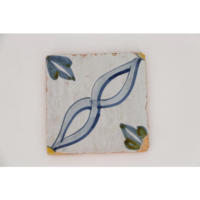 This original Antique Portuguese Blue, White, Green and Brown Baroque Tile was made in Portugal in the period (1706–1750)....