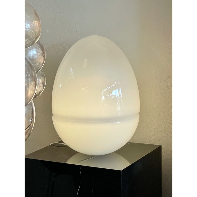 A large Murano glass egg lamp attributed to Carlo Nason for Mazzega. The gorgeous 21" H lamp is made of three parts that...