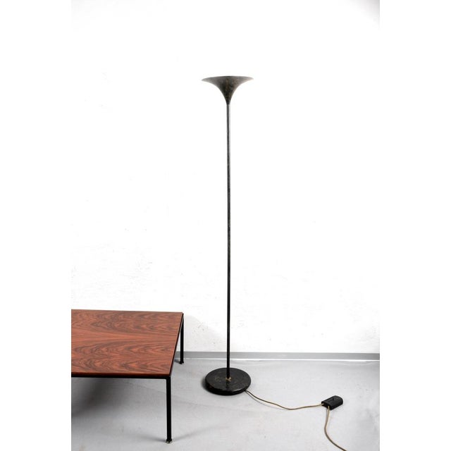 Amazing mid-century black aluminium tulip-shaped floor lamp with gold finishes. This fantastic piece was produced in Italy...