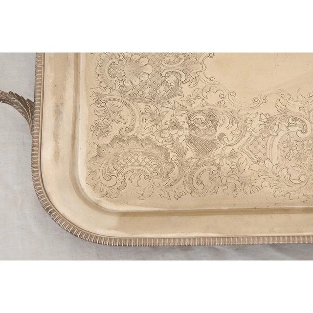 Dimensions: 1 ⅜” H x 27” W x 16 ¼” D A superb English silver plated tray. This rectangular tray features a deep set...