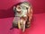 Beautiful large decorative elephant sculpture featuring intricate embossed patterns, hand‑painted detailing, and a raised...