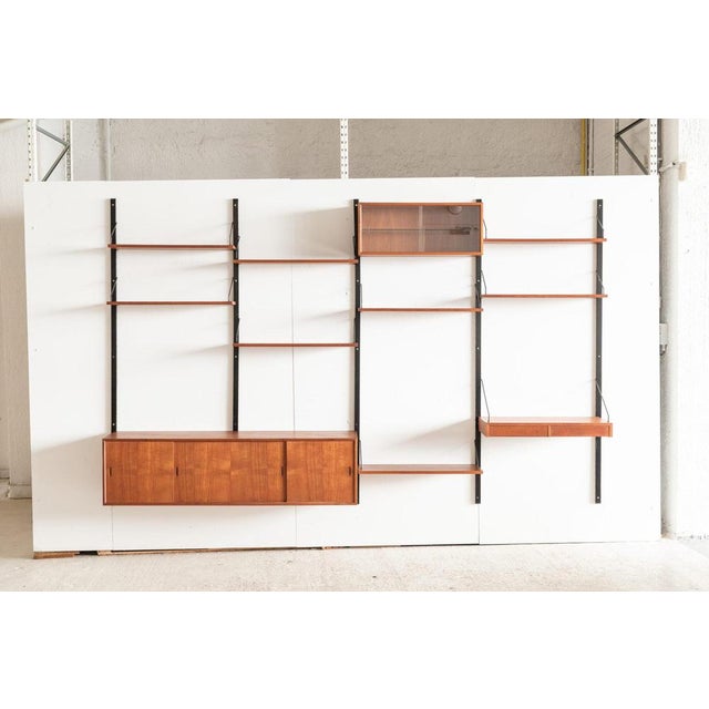 4-Bay teak wall unit, designed by Poul Cadovius and produced by Cadovius in Denmark, during the 1960’s. This Royal series...