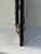 lovely sculptural antique Dutch repousse cushion wall mirror with brass and ebonized wood accents. overall height is 44”...