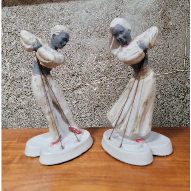 A pair of Chalkware dancing figures by Devonware, Canada. Circa. 1950's. 9.38 inches high. 5 inches wide. 4 inches deep.