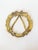 A charming and festive holiday or Christmas brass wreath and bow trivet for your tablescape. It has a wonderful patina....