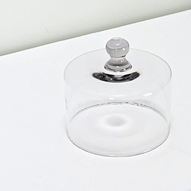 A French hand-made blown glass dome used for covering cheese or pastries, most likely for display in a mercantile shop....