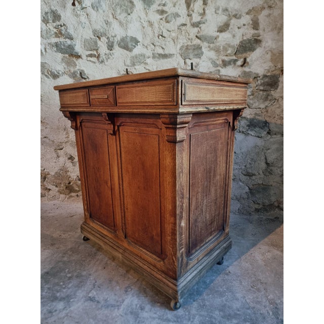 Compact antique French shop counter dating from around 1880–1900. Crafted from solid oak with a warm natural patina, it...