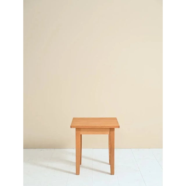 Original square-shaped sofa table from the 1980s. A Scandinavian style coffee table from the 80's studied in the smallest...